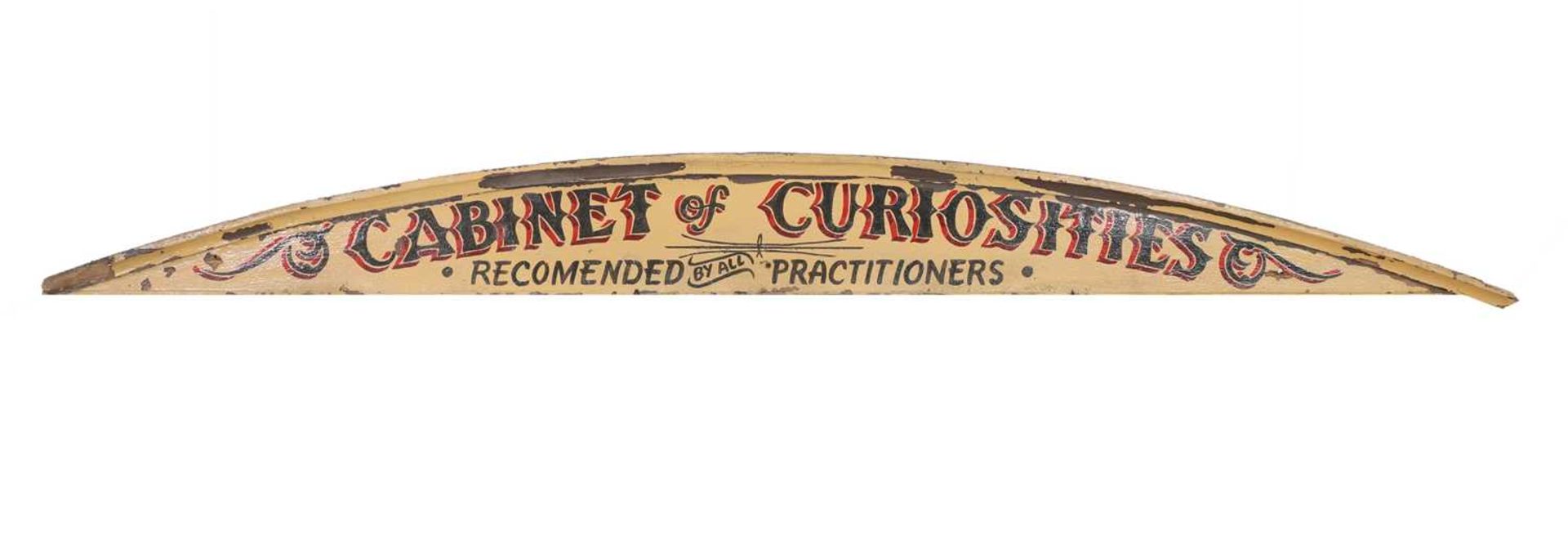 An arched fairground cornice sign,