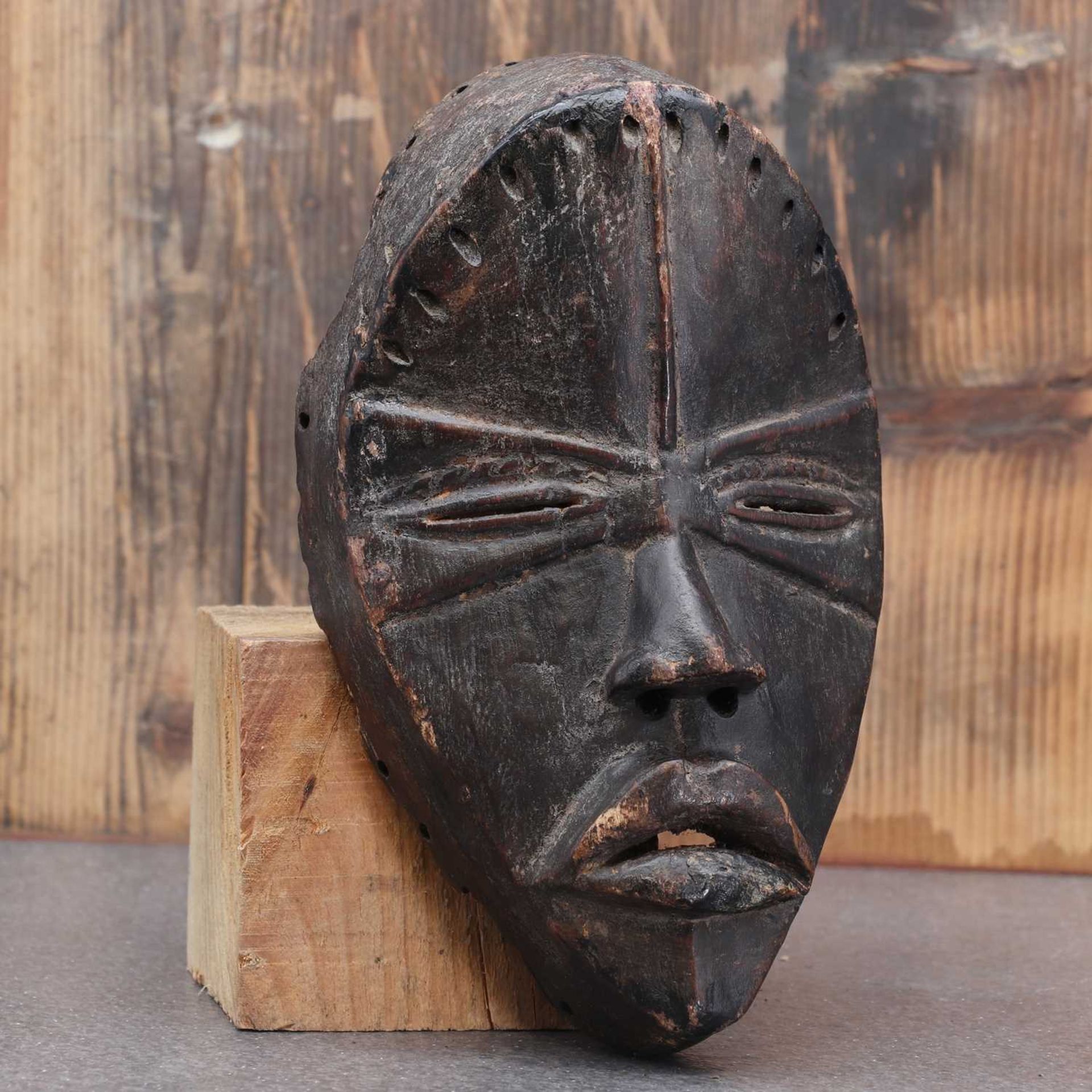 Dan society: a carved and patinated Dan mask,