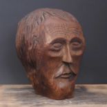 A chip-carved and polished-oak folk art bust,