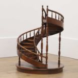 A large fruitwood architectural model of a spiral staircase,