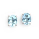 A pair of silver single stone aquamarine stud earrings,