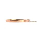 A 9ct hollow gold hinged bangle,