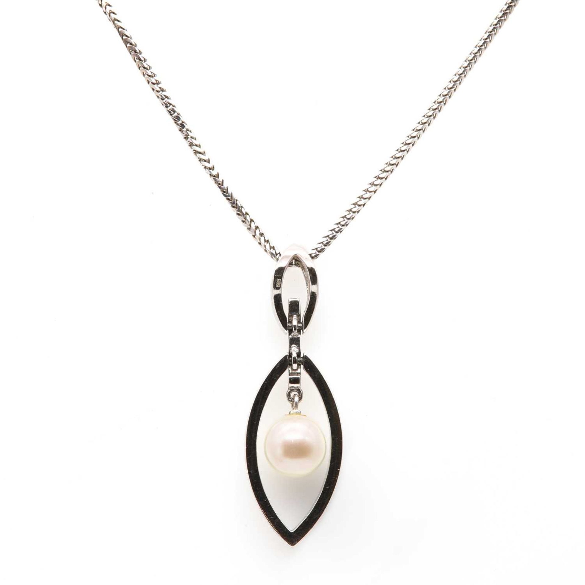 An 18ct white gold diamond and cultured pearl pendant,