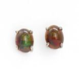 A pair of single stone Ethiopian black opal stud earrings,