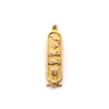 An Egyptian gold cartouche pendant,