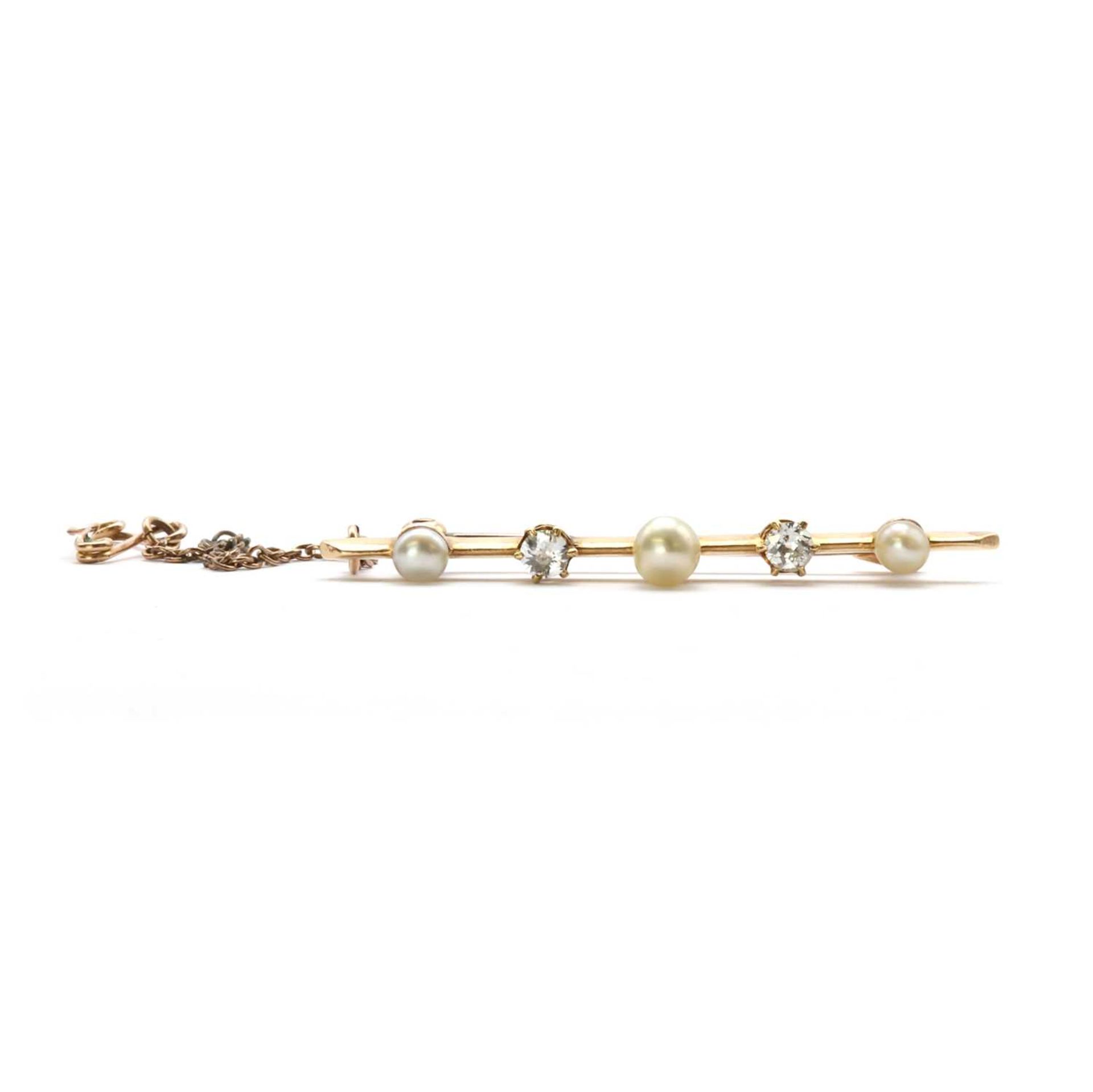 A gold pearl and diamond bar brooch,