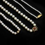 Three cultured pearl necklaces,