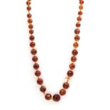 A single row graduated faceted citrine bead necklace,