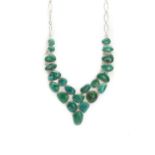 A multi-stone silver and turquoise 'V' shape necklace,