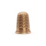 A 9ct gold engraved thimble,