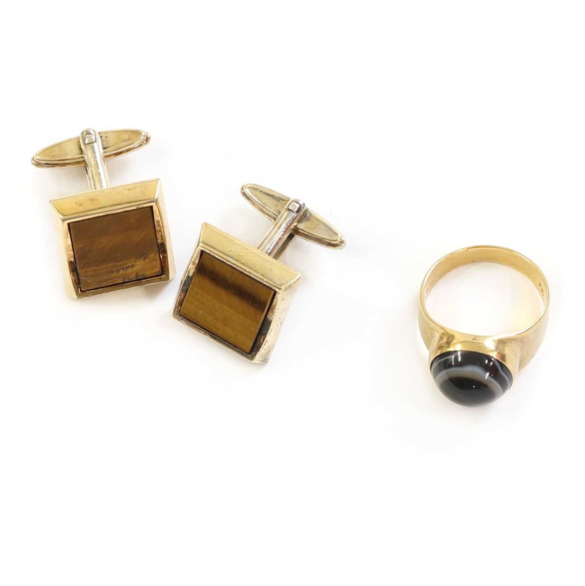 A pair of gold plated tiger's eye Dunhill cufflinks,