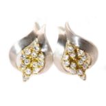 A pair of 18ct yellow and white gold diamond set cluster earrings,