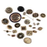 A collection of 27 Georgian and Victorian memorial brooches,