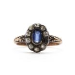 An 18ct gold sapphire and diamond cluster ring,