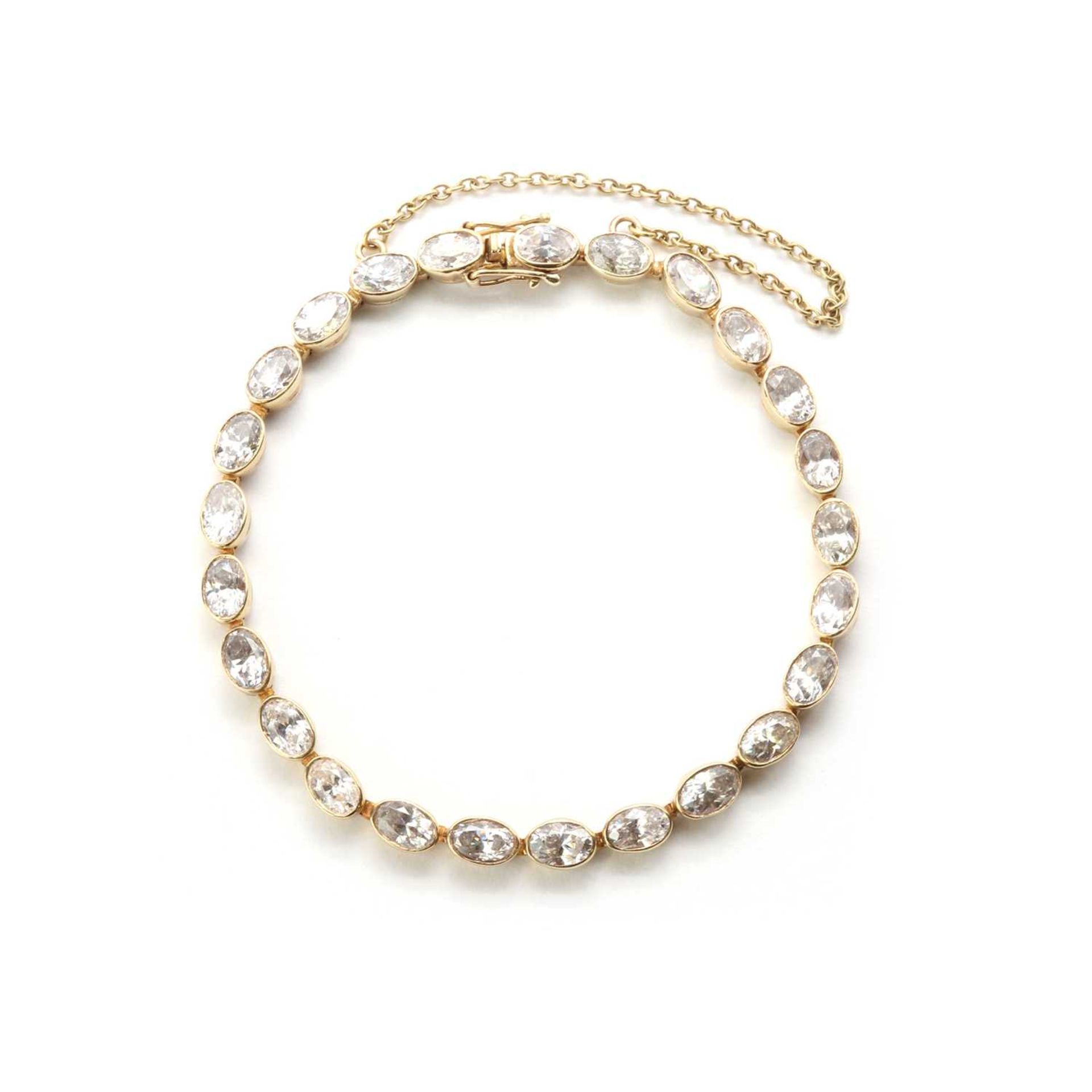 A 9ct gold cubic zirconia line bracelet,