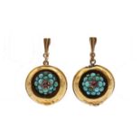 A pair of turquoise earrings,