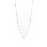 A silver and cubic zirconia station necklace,