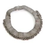 A silver woven collar style necklace,