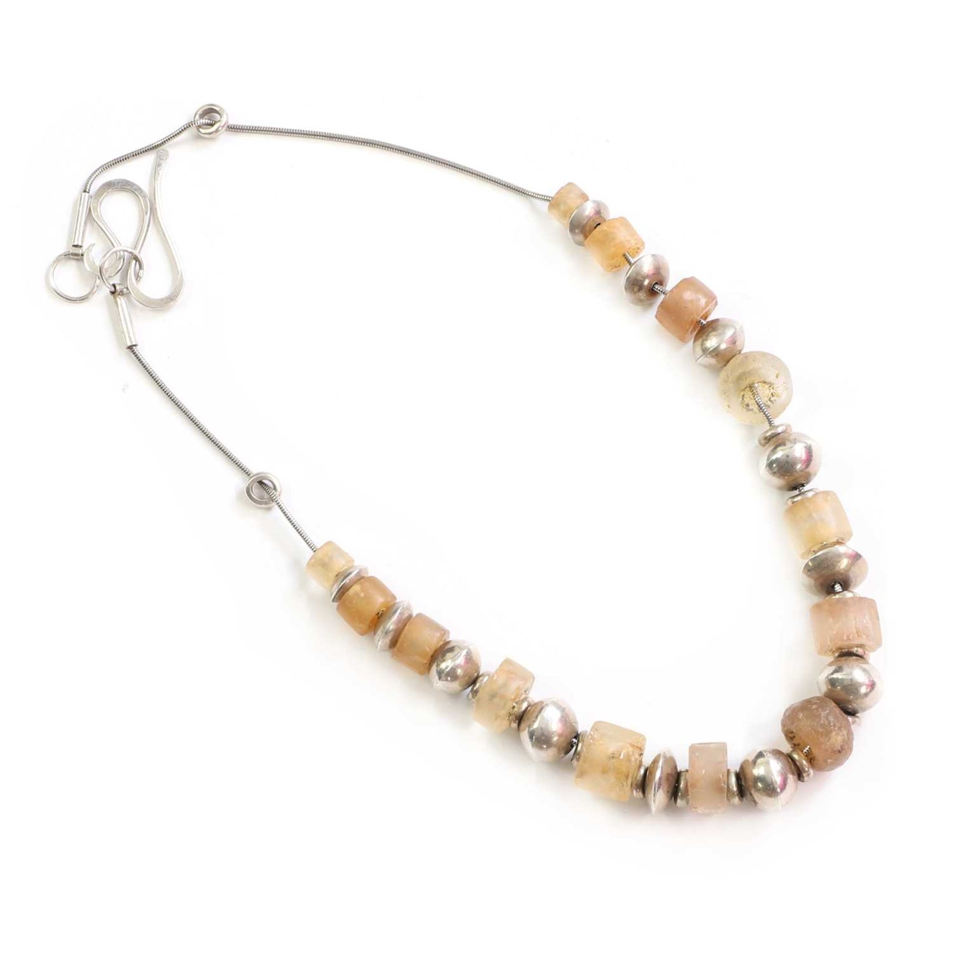 A silver bead necklace, by Jane Martin,