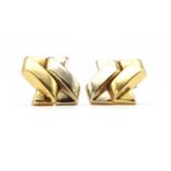 A pair of two colour gold earrings,