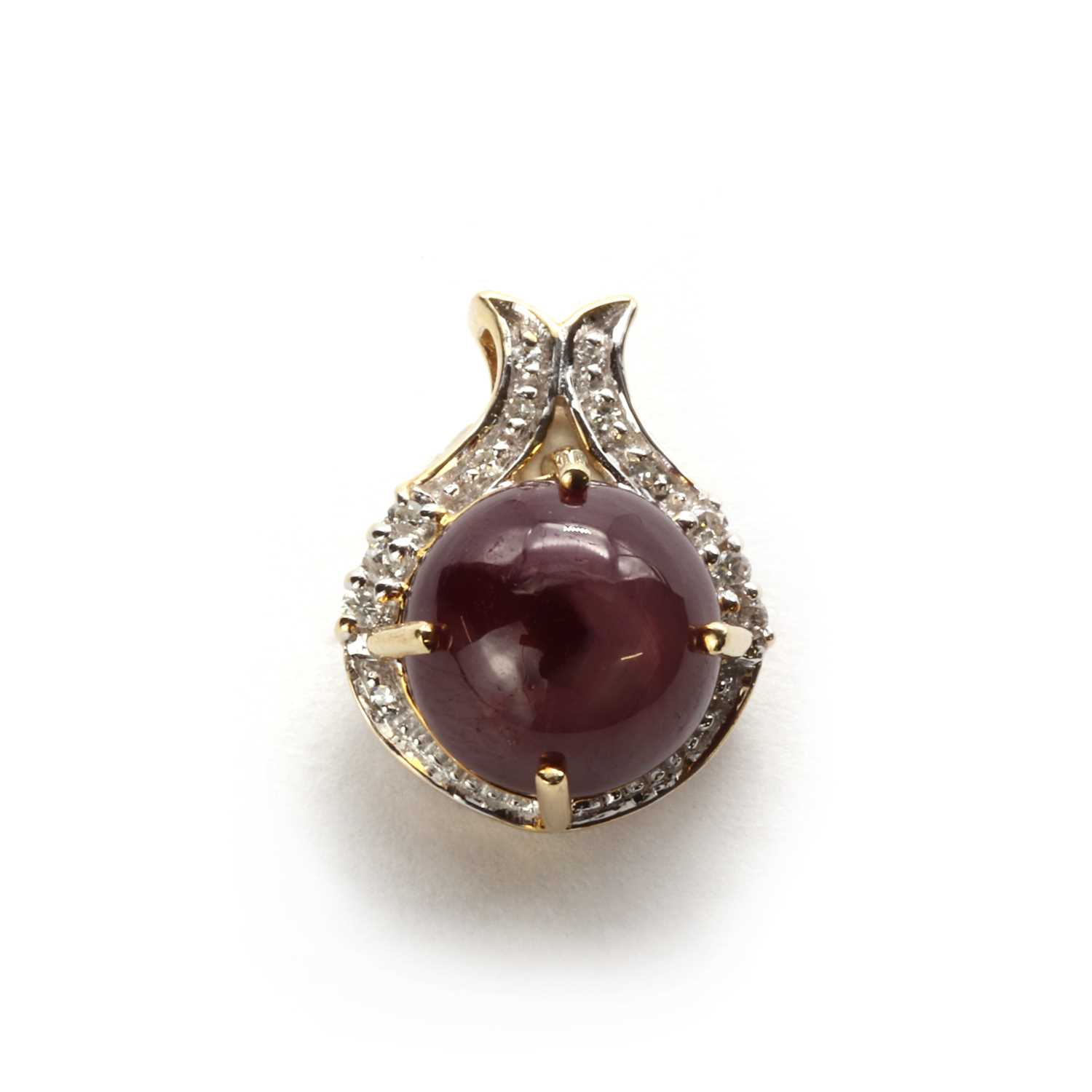A 9ct gold star ruby and diamond pendant,