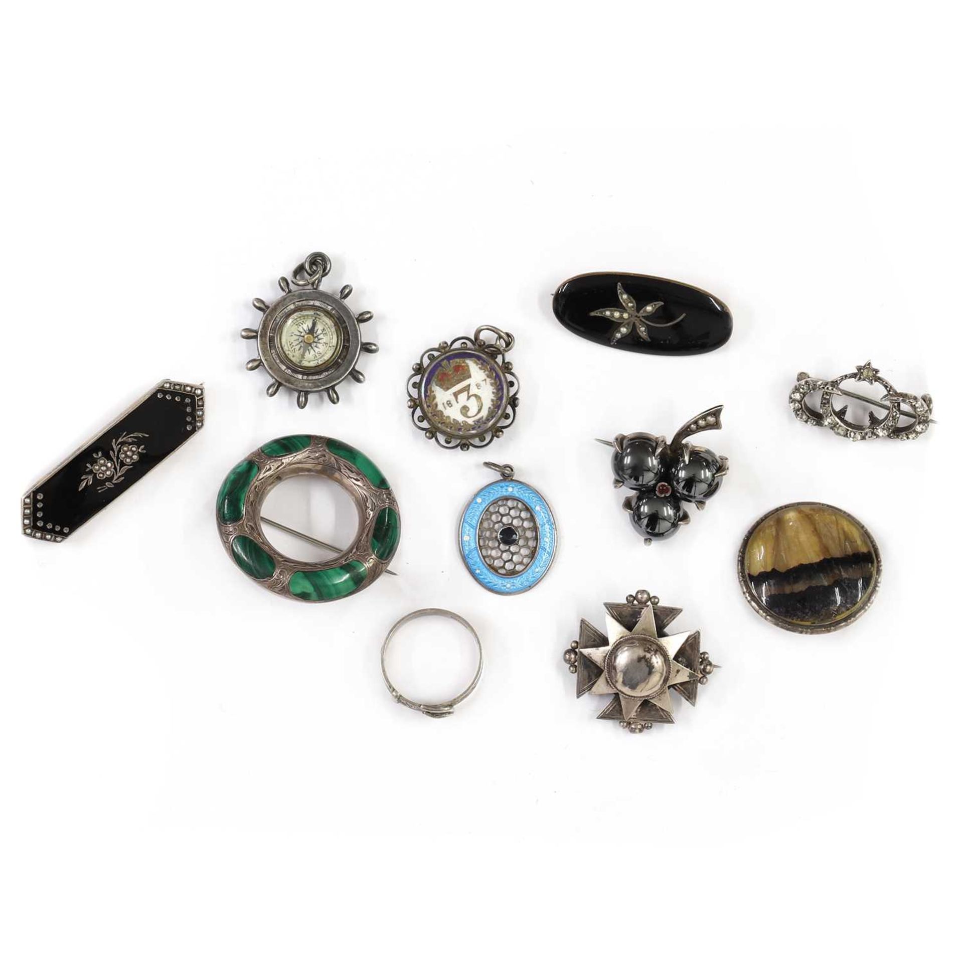 A quantity of Victorian silver brooches,