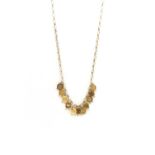 A gold fringe necklace,