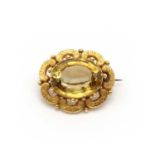 A gold citrine brooch,