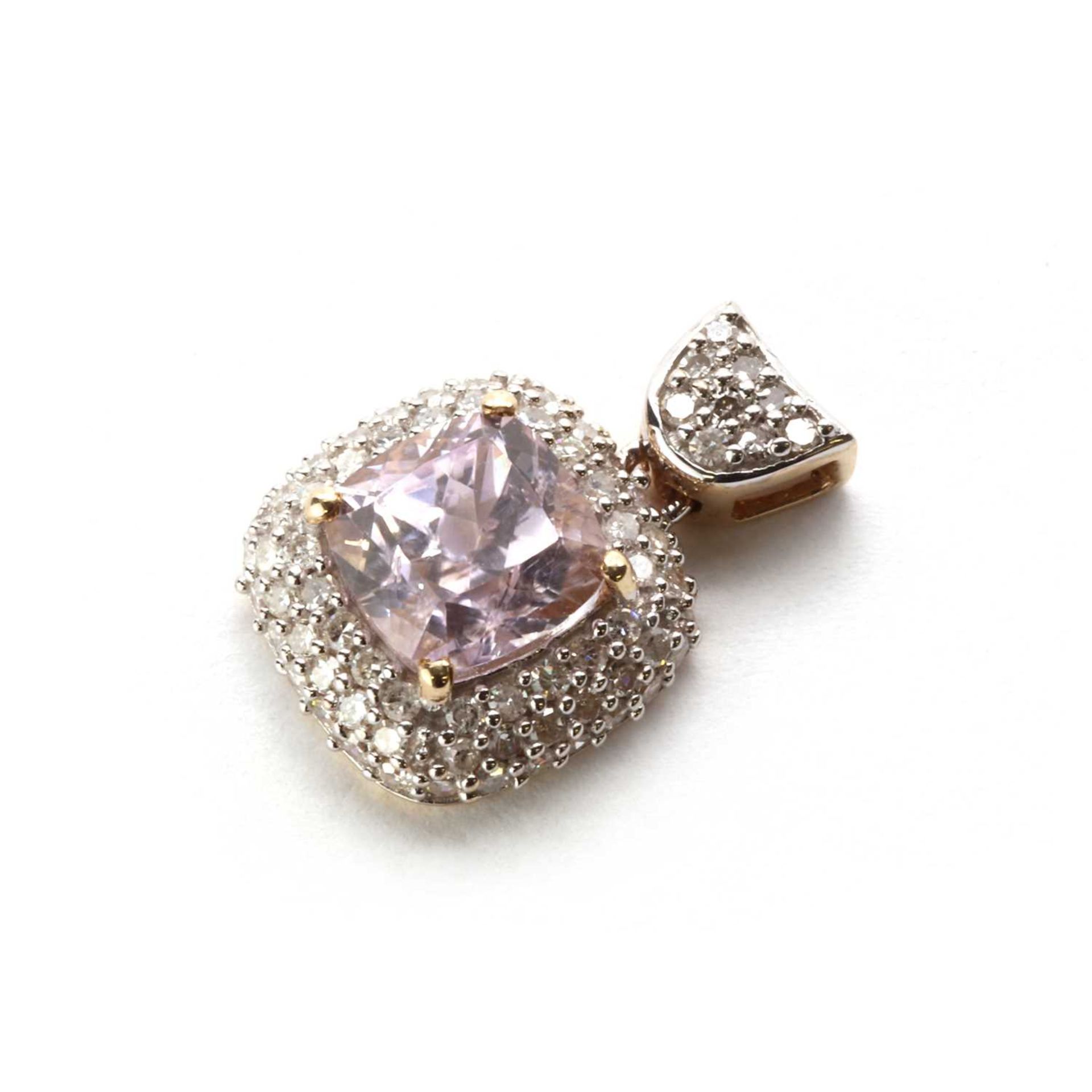 A 9ct gold diamond and pink topaz pendant,