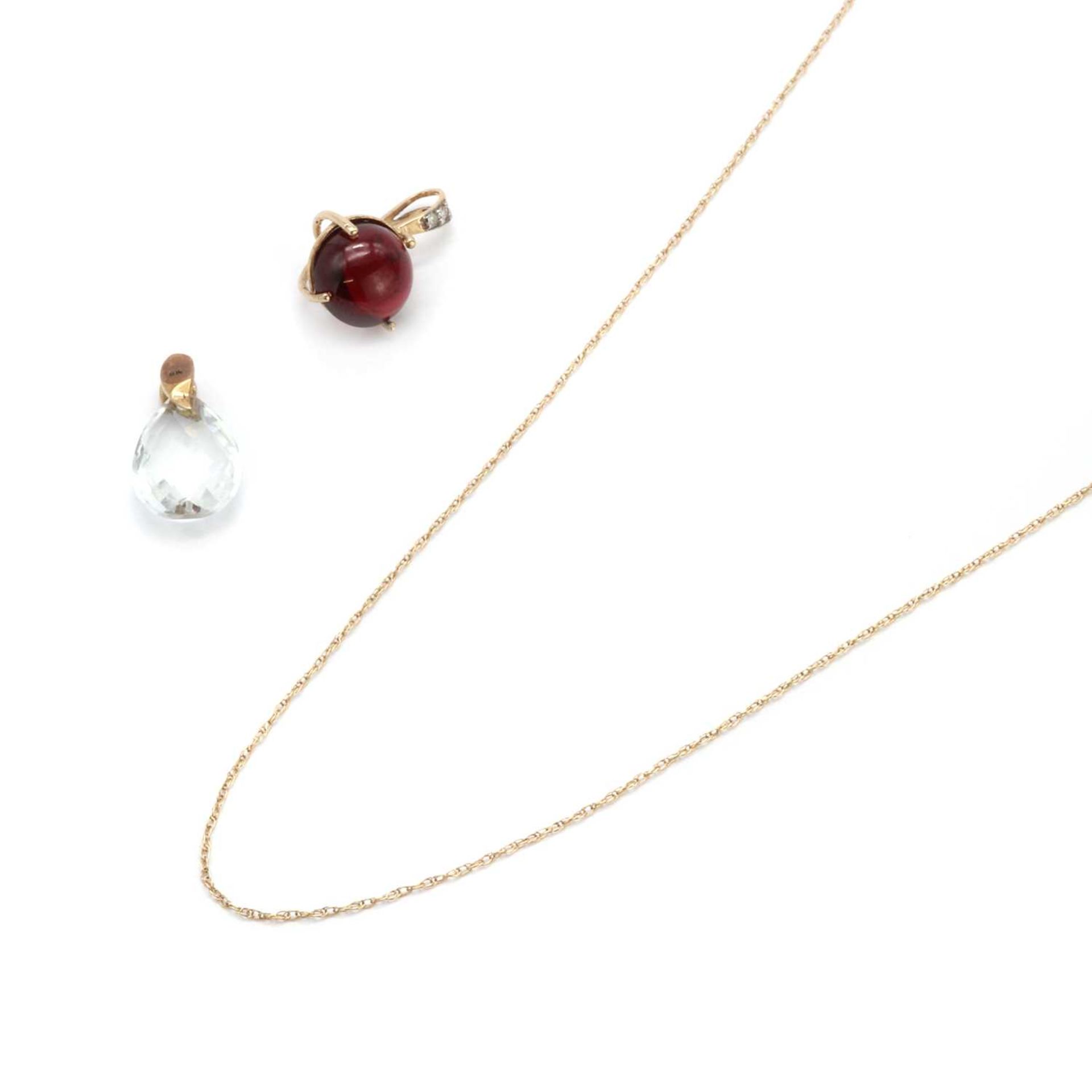 A garnet and diamond pendant,