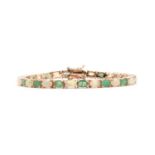 A silver gilt emerald and opal bracelet,