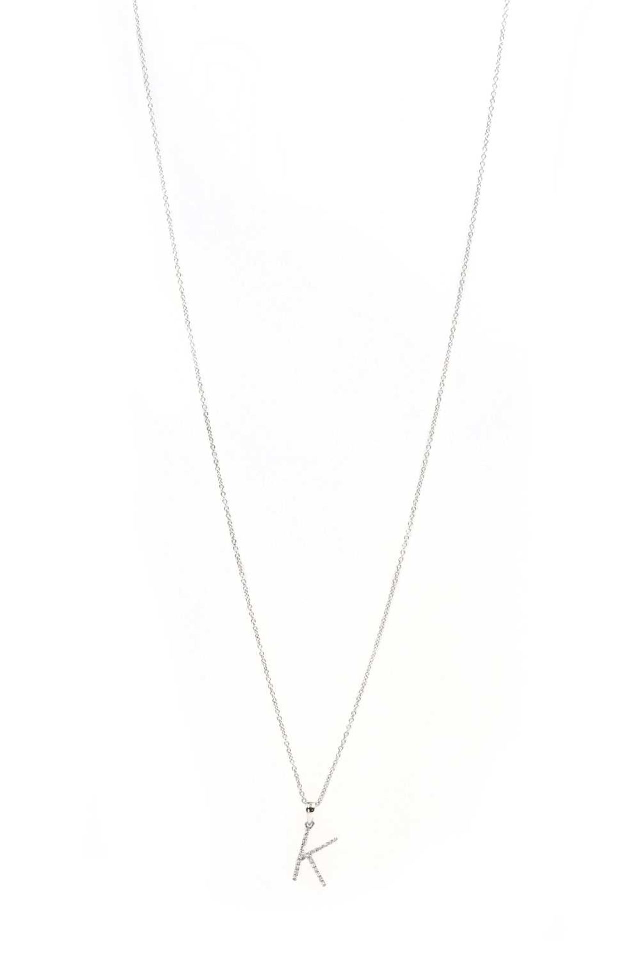 A 9ct white gold diamond initial pendant 'K',