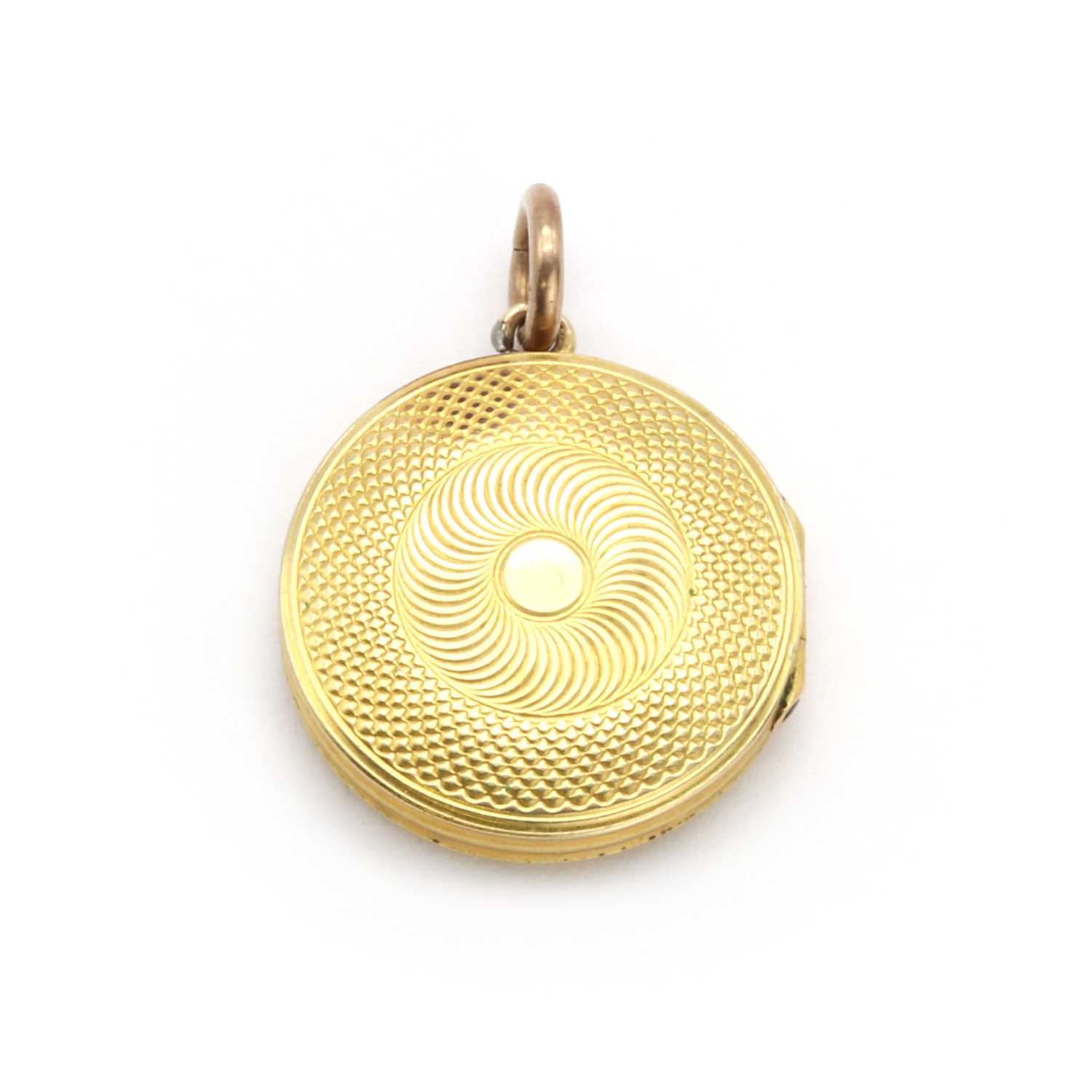 A gold memorial locket,