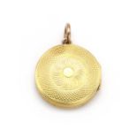 A gold memorial locket,