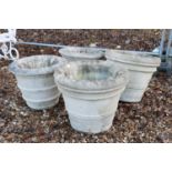 A set of four medium sized reconstituted stone urns,