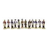 A collection of twelve Sitzendorf porcelain military figures,