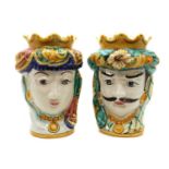 A pair of continental Majolica heads,