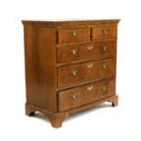 A George II walnut chest of drawers