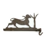 A wrought bronze folk art shop bracket,