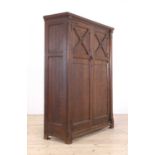 An Aesthetic Movement oak wardrobe,