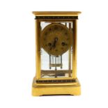 A French brass and champlevé four-glass mantel clock