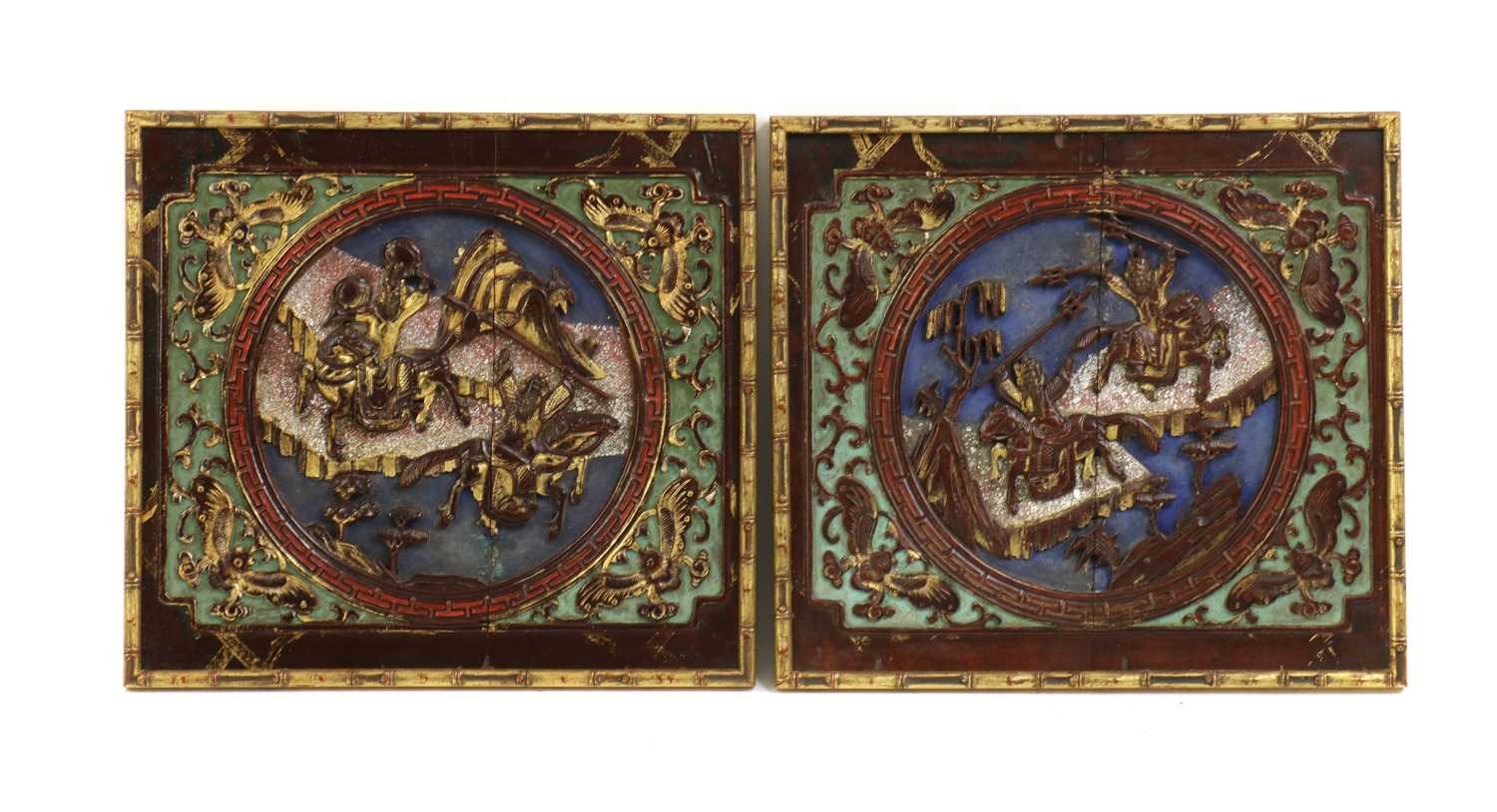 A pair of Chinese gilt lacquered wood panels,