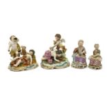 A pair of Continental porcelain figure groups,