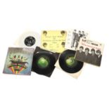 A collection of five Beatles records,
