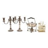A silver-plated pair of three-light candelabras,