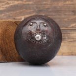 A carved 'bugbear' coconut flask,