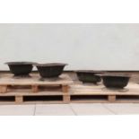 Four cast iron planters,