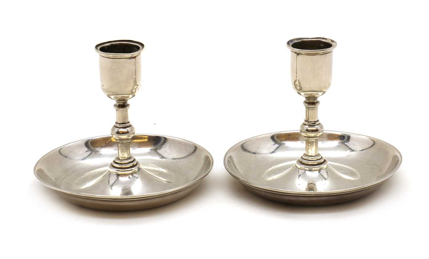 A pair of Victorian silver 'Brighton Bun' travelling candlesticks,