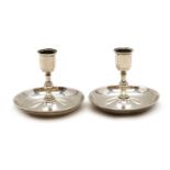 A pair of Victorian silver 'Brighton Bun' travelling candlesticks,