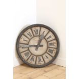 A painted fibreglass clock face,